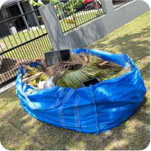 FlexiSkip filled with green waste